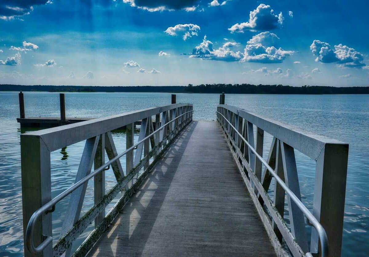A pier on Lake Conroe overlooks blue water