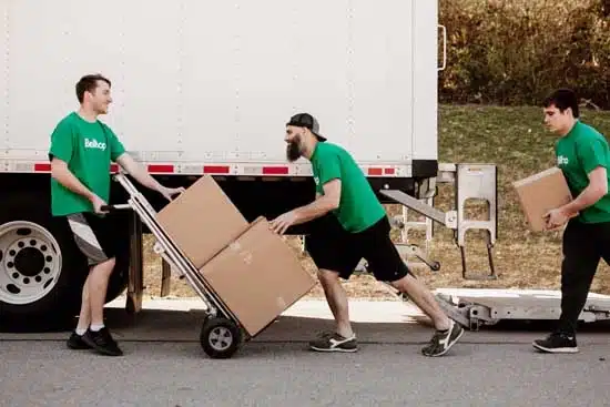 Men moving storage boxes.